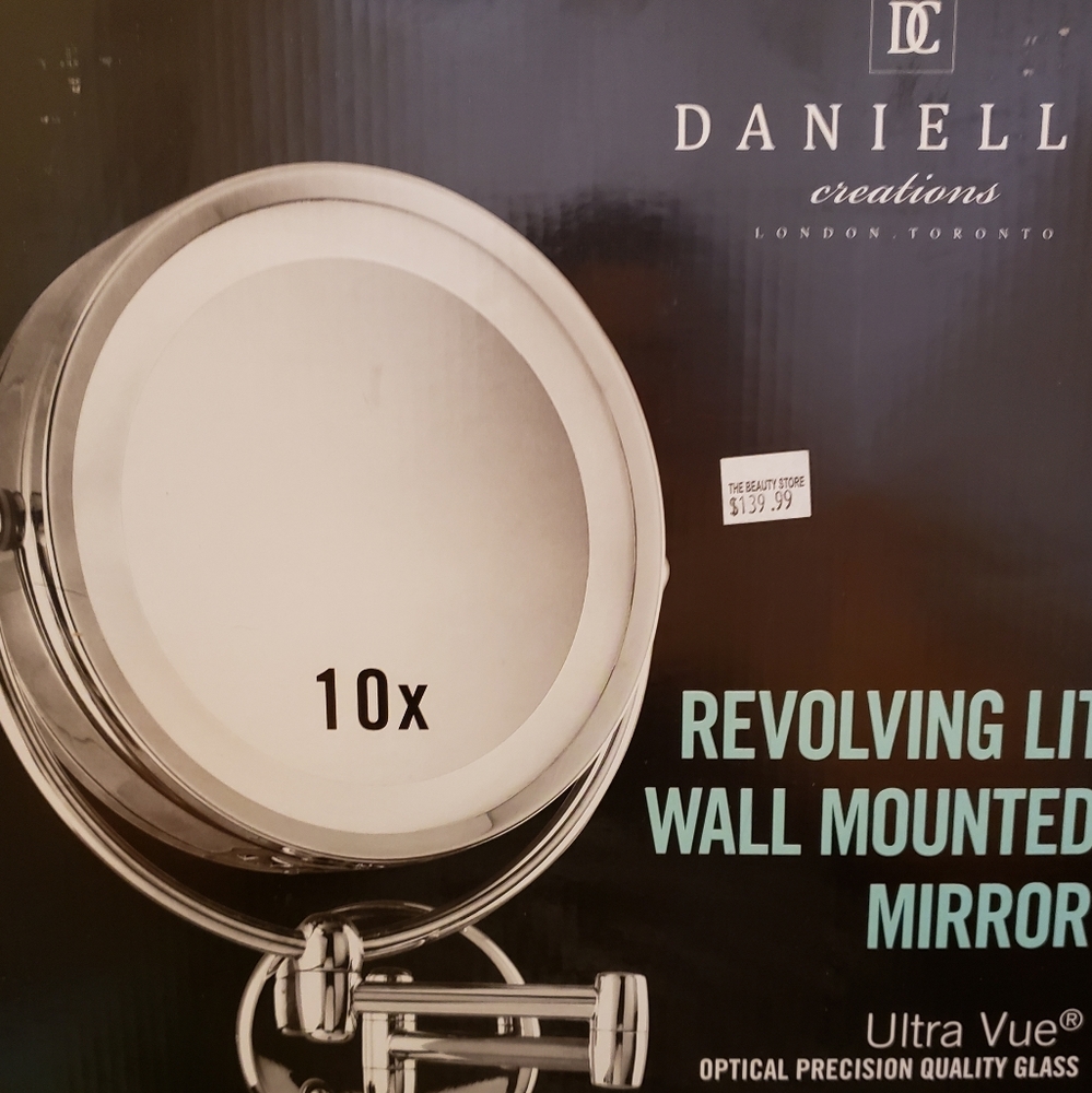 Revolving lit wall mounted mirror 10x